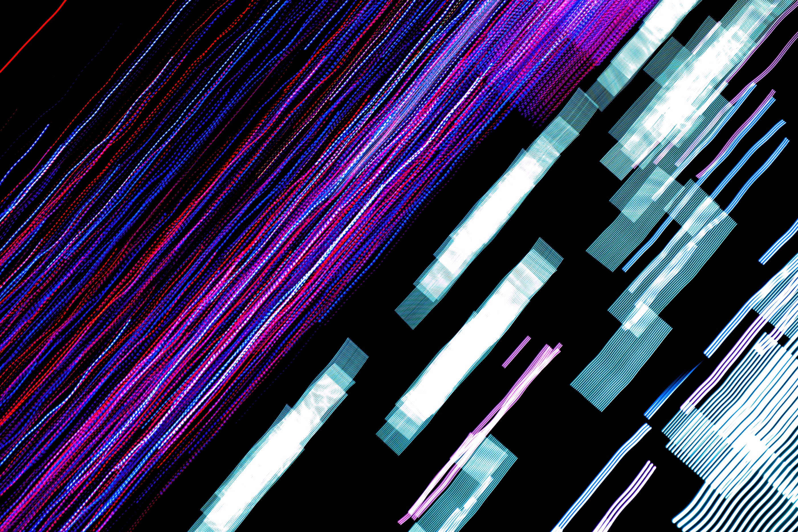 Abstract blue, white, and magenta light trails